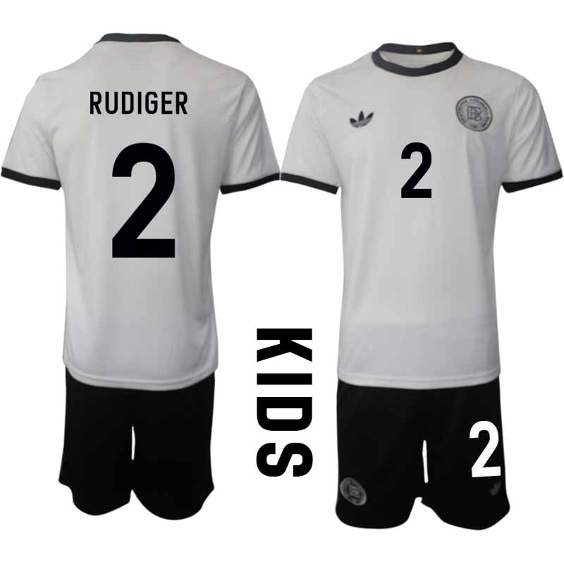 Köp Tyskland Barn Hemmatröja 2025/26 Antonio Rüdiger 2 Fotbollsställ Kortärmad (+ Korta byxor) – Tysklands 125-årsjubileumskit